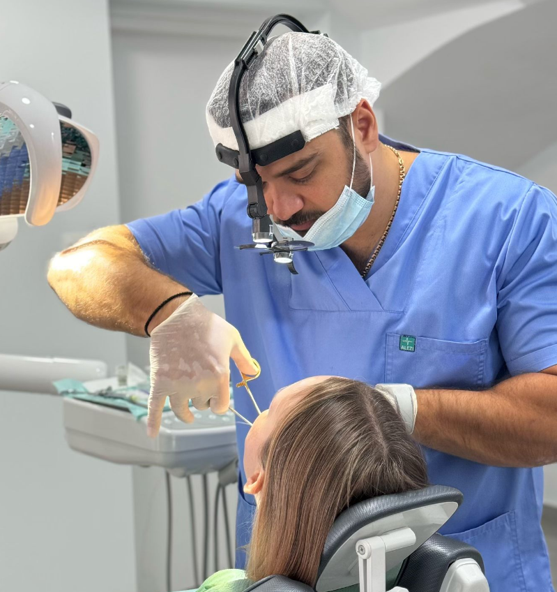 Dr. Alexandros Kalaitsidis conducting a dental check-up on a patient at Dental Clinic Your Smile in Cyprus